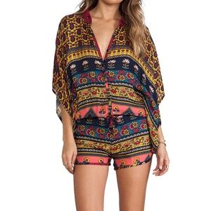 Revolve Novella Royale Lazy Daze Romper in red floral.